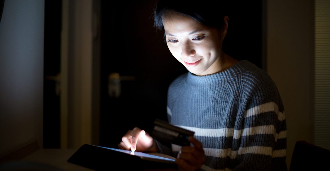 Woman using tablet for online shopping